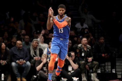 Oklahoma City Thunder forward Paul George gestures after scoring a basket against the Brooklyn Nets during the second half of an NBA basketball game, Wednesday, Dec. 5, 2018, in New York. The Thunder won 114-112. (AP Photo/Julio Cortez)