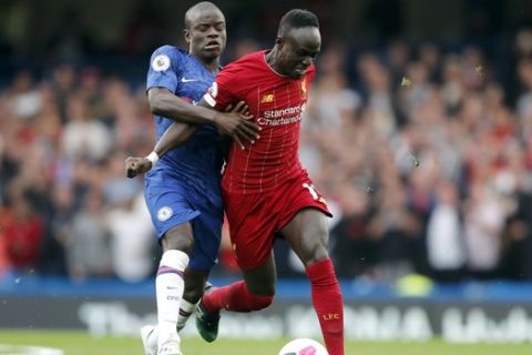 Liverpool's Sadio Mane, right, and Chelsea's N'Golo Kante vie for the ball during the British Premier League soccer match between Chelsea and Liverpool, at the Stamford Bridge Stadium, London, Sunday, Sept. 22, 2019. (AP Photo/Frank Augstein)