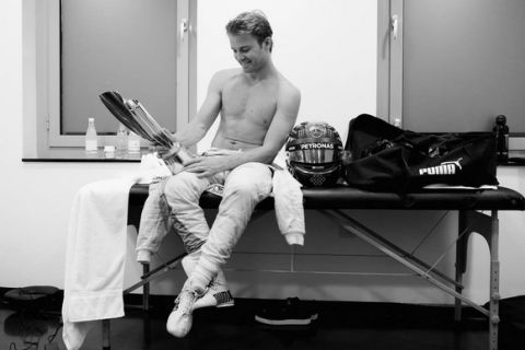 ABU DHABI, UNITED ARAB EMIRATES - NOVEMBER 27:  (EDITORS NOTE: Image has been converted to black and white.) Nico Rosberg of Germany and Mercedes GP  after finishing in second position and securing the F1 World Drivers Campionship in his changing room during the Abu Dhabi Formula One Grand Prix at Yas Marina Circuit on November 27, 2016 in Abu Dhabi, United Arab Emirates.  (Photo by Mark Thompson/Getty Images)