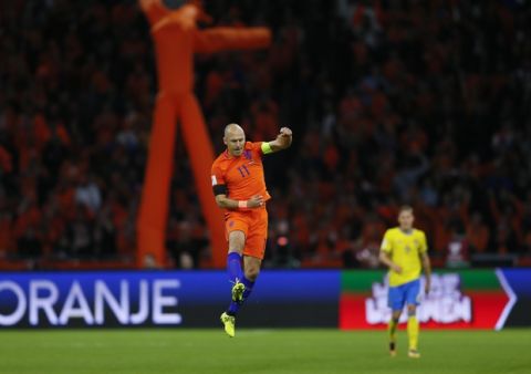 Netherland's Arjen Robben celebrates after scoring the opening goal on a penalty during a World Cup Group A soccer qualifying match between the Netherlands and Sweden at the ArenA stadium in Amsterdam, Netherlands, Tuesday, Oct. 10, 2017. (AP Photo/Peter Dejong)