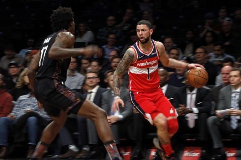 Washington Wizards guard Austin Rivers (1) in action against the Brooklyn Nets during the first half of an NBA basketball game Friday, Dec. 14, 2018, in New York. (AP Photo/Adam Hunger)