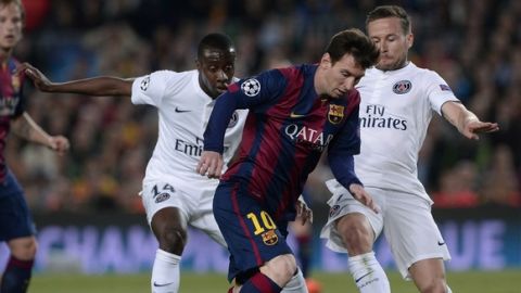 Barcelona's Argentinian forward Lionel Messi (C) vies with Paris Saint-Germain's midfielder Blaise Matuidi (L) and Paris Saint-Germain's midfielder Yohan Cabaye during the UEFA Champions League quarter-finals second leg football match FC Barcelona vs Paris Saint-Germain at the Camp Nou stadium in Barcelona on April 21, 2015.     AFP PHOTO/ JOSEP LAGO        (Photo credit should read JOSEP LAGO/AFP/Getty Images)
