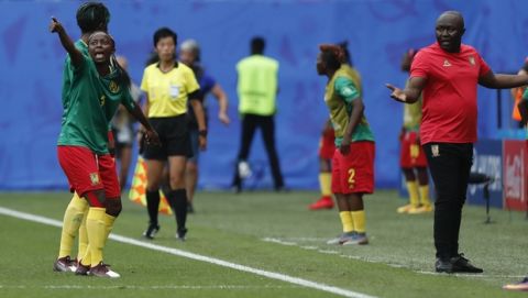 Cameroon's Ajara Nchout, left, and Cameroon head coach Alain Djeumfa react after a VAR decision that ruled out Cameroon's Ajara Nchout's goal for offside during the Women's World Cup round of 16 soccer match between England and Cameroon at the Stade du Hainaut stadium in Valenciennes, France, Sunday, June 23, 2019. (AP Photo/Michel Spingler)