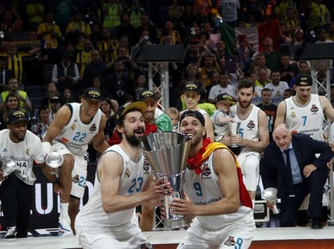 Real Madrid's Felipe Reyes, front right, and Sergio Llull celebrate as they win the Final Four Euroleague final basketball match between Real Madrid and Fenerbahce Istanbul in Belgrade, Serbia, Sunday, May 20, 2018. (AP Photo/Darko Vojinovic)