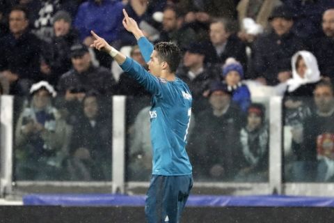 Real Madrid's Cristiano Ronaldo celebrates after scoring the opening goal of his team during the Champions League, round of 8, first-leg soccer match between Juventus and Real Madrid at the Allianz stadium in Turin, Italy, Tuesday, April 3, 2018. (AP Photo/Luca Bruno)