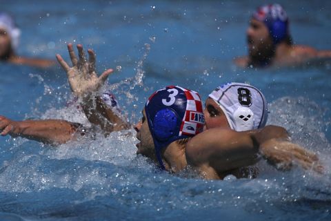 Stylianos Argyropoulos Kanakakis of Greece, right, and Loren Fatovic of Croatia in action during the Men's water polo bronze medal match between Greece and Croatia at the 19th FINA World Championships in Budapest, Hungary, Sunday, July 3, 2022. (AP Photo/Anna Szilagyi)