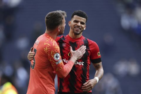 Bournemouth's Dominic Solanke, right, and goalkeeper Neto celebrate their team's 3-2 victory over Tottenham Hotspur at the end of the English Premier League soccer match between Tottenham Hotspur and Bournemouth at Tottenham Hotspur Stadium, in London, England, Saturday, April 15, 2023. (AP Photo/Ian Walton)