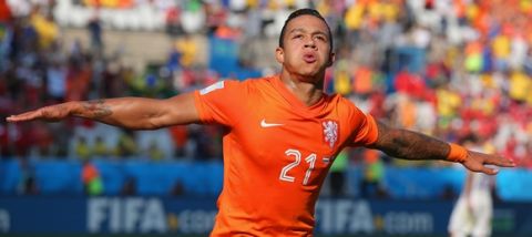 SAO PAULO, BRAZIL - JUNE 23:  Memphis Depay of the Netherlands celebrates scoring his team's second goal during the 2014 FIFA World Cup Brazil Group B match between the Netherlands and Chile at Arena de Sao Paulo on June 23, 2014 in Sao Paulo, Brazil.  (Photo by Dean Mouhtaropoulos/Getty Images)