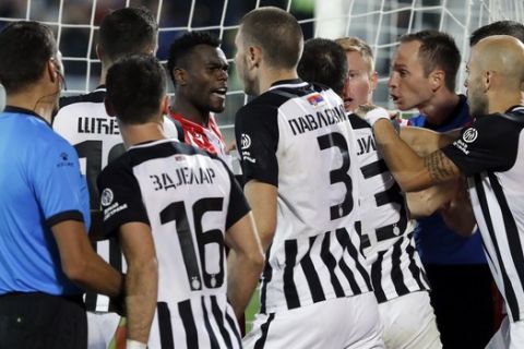 Red Star's Jander, fourth left, talks with Partizan players during a Serbian National soccer league derby match between Partizan and Red Star, in Belgrade, Serbia, Sunday, Sept. 22, 2019. (AP Photo/Darko Vojinovic)