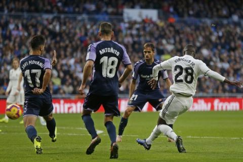 Real Madrid's Vinicius Junior, right, scores his side's 1st goal during a Spanish La Liga soccer match between Real Madrid and Valladolid at the Santiago Bernabeu stadium in Madrid, Spain, Saturday, Nov. 3, 2018. (AP Photo/Paul White)