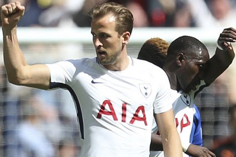 Tottenham Hotspur's Harry Kane celebrates scoring his side's first goal of the game during the English Premier League soccer match between Tottenham Hotspur and Leicester City, at Wembley Stadium, in London, Sunday May 13, 2018. (Steven Paston/PA via AP)