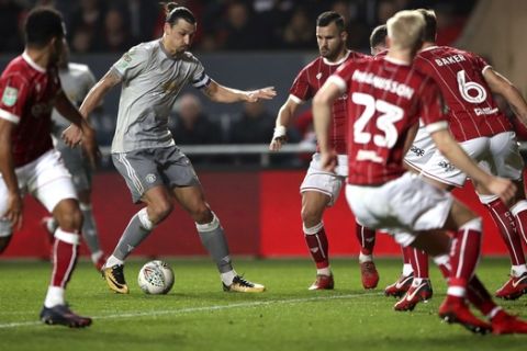 Manchester United's Zlatan Ibrahimovic, centre left, runs with the ball during the English League Cup Quarter Final soccer match between Bristol City and Manchester United at Ashton Gate, Bristol, England, Wednesday, Dec. 20, 2017. (Nick Potts/PA via AP)