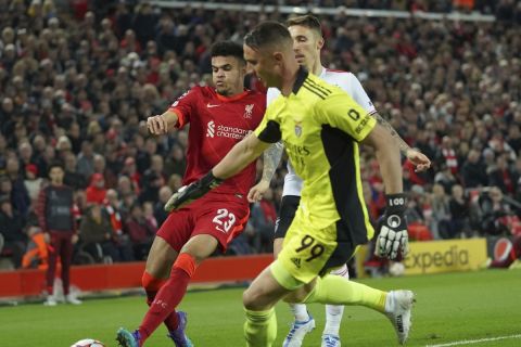 Liverpool's Luis Diaz, left, chases for the ball with Benfica's Alex Grimaldo and Benfica's goalkeeper Odysseas Vlachodimos, 99, during the Champions League quarterfinal second leg soccer match between Liverpool and Benfica, at Anfield stadium in Liverpool, England, Wednesday, April 13, 2022. (AP Photo/Jon Super)