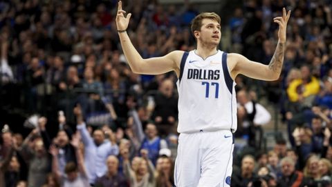 Dallas Mavericks forward Luka Doncic (77) reacts after making a 3-pointer against the Houston Rockets during the second half of an NBA basketball game, Saturday, Dec. 8, 2018, in Dallas. (AP Photo/Cooper Neill)