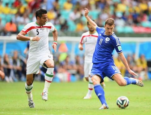 SALVADOR, BRAZIL - JUNE 25:  Edin Dzeko of Bosnia and Herzegovina shoots and scores his team's first goal during the 2014 FIFA World Cup Brazil Group F match between Bosnia and Herzegovina and Iran at Arena Fonte Nova on June 25, 2014 in Salvador, Brazil.  (Photo by Laurence Griffiths/Getty Images)