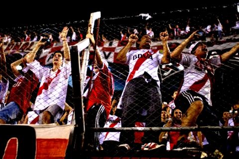 Argentina's River Plate fans cheer their team during a Copa Sudamericana soccer match against Paraguay's Libertad in Buenos Aires, Argentina, Wednesday, Oct. 22, 2014.  (AP Photo/Natacha Pisarenko)