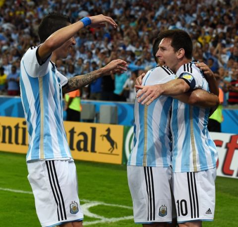 RIO DE JANEIRO, BRAZIL - JUNE 15:  Lionel Messi of Argentina (R) celebrates scoring his team's second goal with teammates during the 2014 FIFA World Cup Brazil Group F match between Argentina and Bosnia-Herzegovina at Maracana on June 15, 2014 in Rio de Janeiro, Brazil.  (Photo by Matthias Hangst/Getty Images)