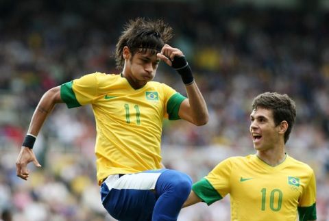 Brazil's Neymar (11) celebrates his goal with Oscar (10) during their quarterfinal men's soccer match against Honduras at St James' Park in Newcastle, England, during the London 2012 Summer Olympics, Saturday, Aug. 4, 2012. (AP Photo/Scott Heppell)