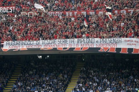 Milan's fans show a banner welcoming the team's new Chinese owners during an Italian Serie A soccer match between Inter Milan and AC Milan, at the San Siro stadium in Milan, Italy, Saturday, April15, 2017. (AP Photo/Antonio Calanni)