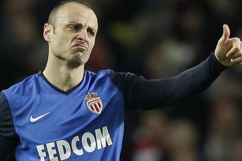 Monaco's Dimitar Berbatov gestures after scoring his side's second goal during the Champions League round of 16 soccer match between Arsenal and AS Monaco at the Emirates Stadium in London, Wednesday, Feb. 25, 2015.  (AP Photo/Matt Dunham)

