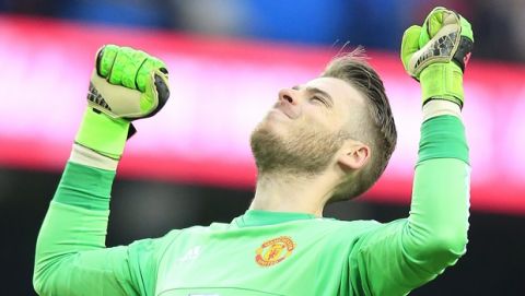 Uniteds goalkeeper David de Gea celebrates after his team won the English Premier League soccer match between Manchester City and Manchester United at the Etihad stadium in Manchester, Sunday, March 20, 2016.(AP Photo/Jon Super)