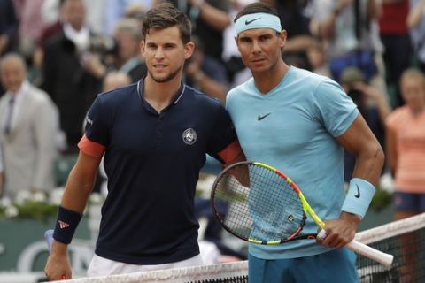 Spain's Rafael Nadal, right, and Austria's Dominic Thiem pose for photographers prior to the men's final match of the French Open tennis tournament at the Roland Garros stadium in Paris, France, Sunday, June 10, 2018. (AP Photo/Alessandra Tarantino)