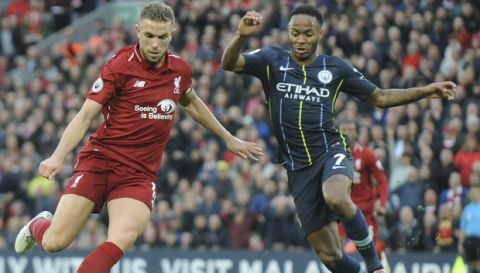 Liverpool's Jordan Henderson, left, and Manchester City's Raheem Sterling vie for the ball during the English Premier League soccer match between Liverpool and Manchester City at Anfield stadium in Liverpool, England, Sunday, Oct. 7, 2018. (AP Photo/Rui Vieira)