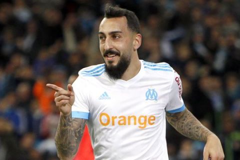 Marseille's Konstantinos Mitroglou gestures after scoring during the League One soccer match between Marseille and Caen, at the Velodrome stadium, in Marseille, southern France, Sunday, Nov. 5, 2017. (AP Photo/Claude Paris)