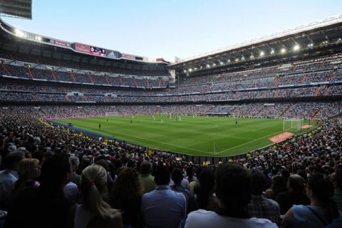 MADRID, SPAIN - AUGUST 25:  Spectators watch the La liga match between Real Madrid CF and Cordoba CF at Estadio Santiago Bernabeu on August 25, 2014 in Madrid, Spain.  (Photo by Denis Doyle/Getty Images)