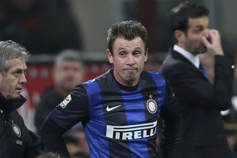 Inter Milan forward Antonio Cassano is assisted by a team doctor during a Serie A soccer match between Inter Milan and Atalanta, at the San Siro stadium in Milan, Italy, Sunday, April 7, 2013. (AP Photo/Luca Bruno)
