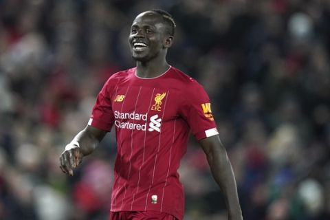 Liverpool's Sadio Mane reacts after having a goal disallowed during the English Premier League soccer match between Liverpool and West Ham at Anfield Stadium in Liverpool, England, Monday, Feb. 24, 2020. (AP Photo/Jon Super)