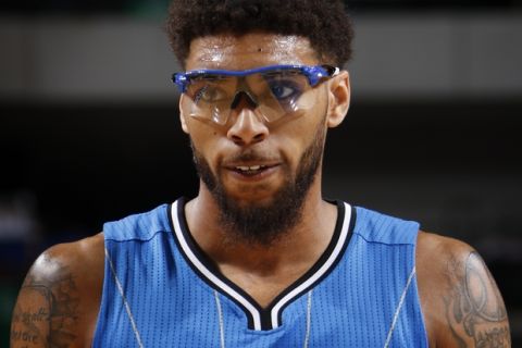 DALLAS, TX - MARCH 1:  A close up shot of Devyn Marble #11 of the Orlando Magic during the game against the Dallas Mavericks on March 1, 2016 at the American Airlines Center in Dallas, Texas. NOTE TO USER: User expressly acknowledges and agrees that, by downloading and or using this photograph, User is consenting to the terms and conditions of the Getty Images License Agreement. Mandatory Copyright Notice: Copyright 2016 NBAE (Photo by Glenn James/NBAE via Getty Images)