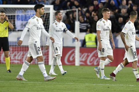 Real Madrid's players leave the pitch after losing the match against Deportivo Alaves during the Spanish La Liga soccer match between Real Madrid and Deportivo Alaves at Mendizorroza stadium, in Vitoria, northern Spain, Saturday, Oct. 6, 2018. Deportivo Alaves won the match 1-0. (AP Photo/Alvaro Barrientos)
