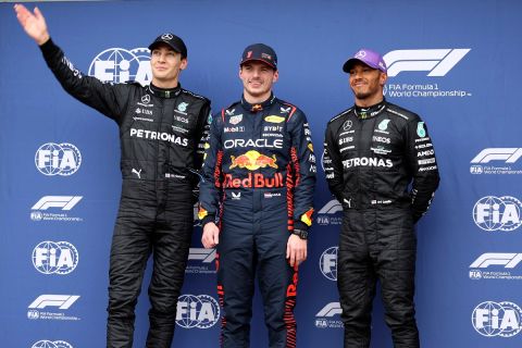 The top 3 fastest qualifiers, Mercedes driver George Russell of Britain, left, Red Bull driver Max Verstappen of Netherlands and Mercedes driver Lewis Hamilton of Britain, right, pose for a photo ahead of the Australian Formula One Grand Prix at Albert Park in Melbourne, Saturday, April 1, 2023. Verstappen qualified fasted, Russell second and Hamilton is 3rd. (AP Photo/Asanka Brendon Ratnayake)