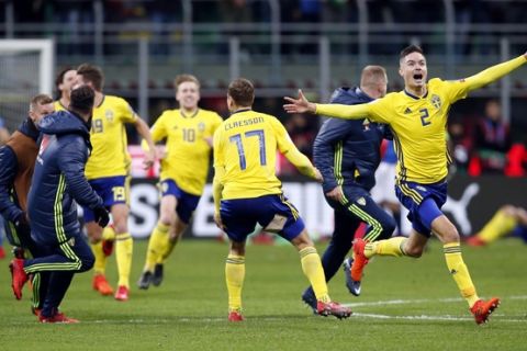 Sweden's players celebrate at the end of the World Cup qualifying play-off second leg soccer match between Italy and Sweden, at the Milan San Siro stadium, Italy, Monday, Nov. 13, 2017. The match ended in a 0-0 draw and Sweden earns a bench to the World Cup. (AP Photo/Antonio Calanni)