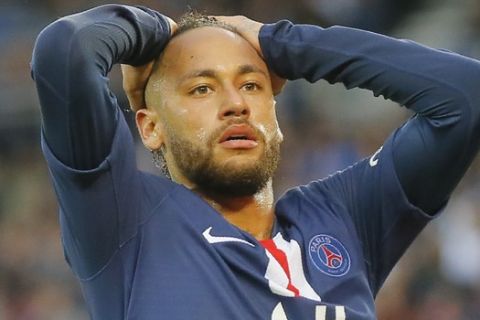 PSG's Neymar reacts after missing goal opportunity during French League One soccer match between PSG and Angers at the Parc des Princes stadium in Paris, Saturday, Oct. 5, 2019. (AP Photo/Michel Euler)
