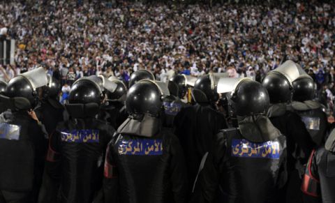 Egyptian riot police stand guard in Cairo Stadium during the first half of a match between Zamalek and Ismaili clubs in Cairo on February 1, 2012.  At least 73 people were killed in fan violence after a football match between Al-Ahly and Al-Masry clubs in the city of Port Said, the health ministry said, as Egypt struggled with a wave of incidents linked to poor security. AFP PHOTO/MAHMUD HAMS (Photo credit should read MAHMUD HAMS/AFP/Getty Images)