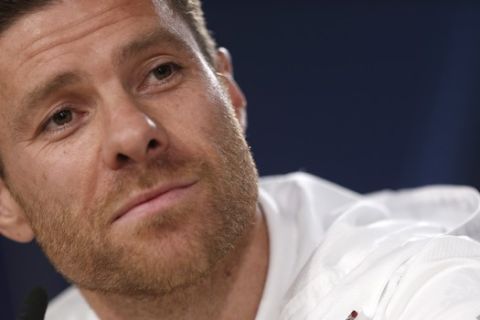 FILE - In this April 17, 2017 file photo, Bayern Munich's Xabi Alonso listens to a question during a news conference at the Santiago Bernabeu stadium in Madrid, Spain. Spanish prosecutors are seeking a five-year prison sentence for former Real Madrid player Xabi Alonso for allegedly defrauding tax authorities of about 2 million euros (2.4 million dollars) from 2010-12. The retired Spain midfielder played for Madrid from 2009-2014. (AP Photo/Francisco Seco, File)