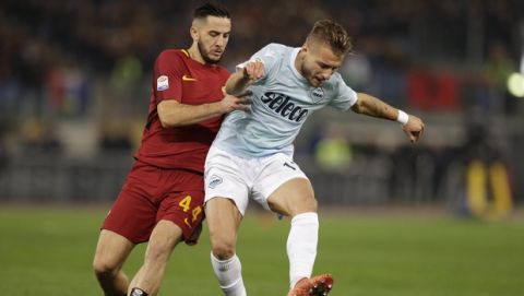 Lazio's Ciro Immobile, right, and Roma's Kostas Manolas, vie for the ball during an Italian Serie A soccer match between AS Roma and Lazio, at the Olympic stadium in Rome, Saturday, Nov. 18, 2017. (AP Photo/Andrew Medichini)