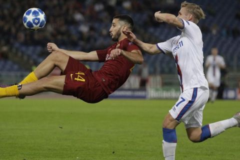 Roma defender Kostas Manolas, left, and CSKA midfielder Arnor Sigurdsson vie for the ball during a Champions League, Group G soccer match between AS Roma and CSKA Moscow, at the Olympic stadium in Rome, Tuesday, Oct. 23, 2018. (AP Photo/Gregorio Borgia)
