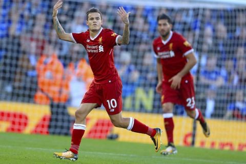 Liverpool's Philippe Coutinho celebrates scoring his side's first goal of the game during the Premier League soccer match. Leicester City versus Liverpool at the King Power Stadium, Leicester, England,  Saturday Sept. 23, 2017. (Mike Egerton/PA via AP)
