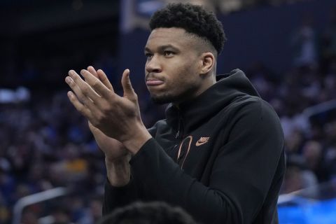 Milwaukee Bucks forward Giannis Antetokounmpo reacts from the bench during the second half of an NBA basketball game against the Golden State Warriors in San Francisco, Saturday, March 11, 2023. (AP Photo/Jeff Chiu)