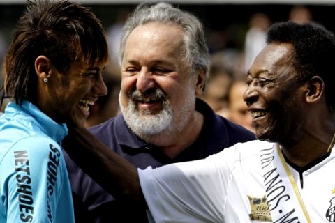 FILE - In this April 14, 2012 file photo, soccer player Neymar, left, and former soccer player Pele, right,  shares a laugh during the centennial anniversary celebration of the team in Santos, Brazil. Brazils most promising player in decades is living up to expectations, enchanting with his skills and putting up numbers that set him on a path to greatness. He is already Brazils fifth-greatest goal scorer, and is well on pace to surpass Peles record as the nations most prolific scorer. If Neymar keeps scoring like this, he may break Peles record before he turns 28 in 2020. Pele was only two months older than Neymar when he netted his 40th goal. Only Pele and Romario have a better goal average than Neymar with the national team. (AP Photo/Nelson Antoine, File)