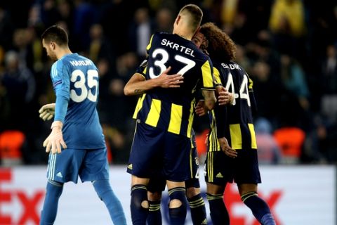 Fenerbahce's players celebrated their win against Zenit St. Petersburg after end of the Europa League round of 32 soccer match between Fenerbahce and Zenit at the Sukru Saracoglu stadium, in Istanbul, Tuesday, Feb. 12, 2019. (AP Photo/Lefteris Pitarakis)