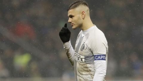 FILE - In this Jan. 31, 2019 file photo, Inter Milan's Mauro Icardi gestures during an Italian Cup quarterfinal soccer match between Inter Milan and Lazio at the San Siro stadium, in Milan, Italy. Two months ago, Mauro Icardi was one of Inter Milan's favored players, on Thursday, Feb. 14, 2019, he was training with just a handful of teammates at their training ground after a rapid fall from grace after Icardi and Inter have been in protracted talks over renewing his contract, which expires in 2021, with agent-wife Wanda Nara being particularly outspoken over the past month. (AP Photo/Luca Bruno, file)