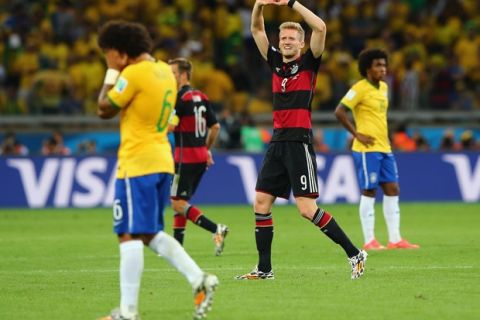 BELO HORIZONTE, BRAZIL - JULY 08:  Andre Schuerrle of Germany celebrates scoring his team's seventh goal and his second of the game during the 2014 FIFA World Cup Brazil Semi Final match between Brazil and Germany at Estadio Mineirao on July 8, 2014 in Belo Horizonte, Brazil.  (Photo by Martin Rose/Getty Images)