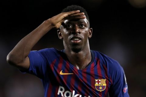 Barcelona forward Ousmane Dembele celebrates after scoring his side's second goal during the group B Champions League soccer match between FC Barcelona and PSV Eindhoven at the Camp Nou stadium in Barcelona, Spain, Tuesday, Sept. 18, 2018. (AP Photo/Manu Fernandez)