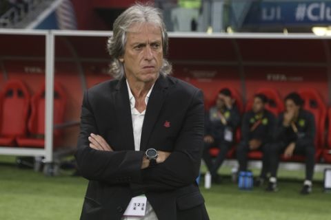 Flamengo's head coach Jorge Jesus look on at the start of the Club World Cup final soccer match between Liverpool and Flamengo at Khalifa International Stadium in Doha, Qatar, Saturday, Dec. 21, 2019. (AP Photo/Hussein Sayed)