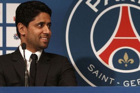 FILE - In this Wednesday, Jan. 29, 2014 file photo PSG President Nasser Al-Khelaifi smiles during a press conference, at the Parc des Princes stadium in Paris. A French judicial official says Al-Khelaifi, the president of Paris Saint-Germain, has been placed under investigation for suspected corruption. (AP Photo/Thibault Camus, File)