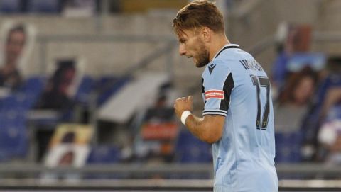 Lazio's Ciro Immobile celebrates after scoring his side's second goal during a Serie A soccer match between Lazio and Cagliari, at the Rome's Olympic Stadium, in Rome, Italy, Thursday, July 23, 2020. (AP Photo/Riccardo De Luca)